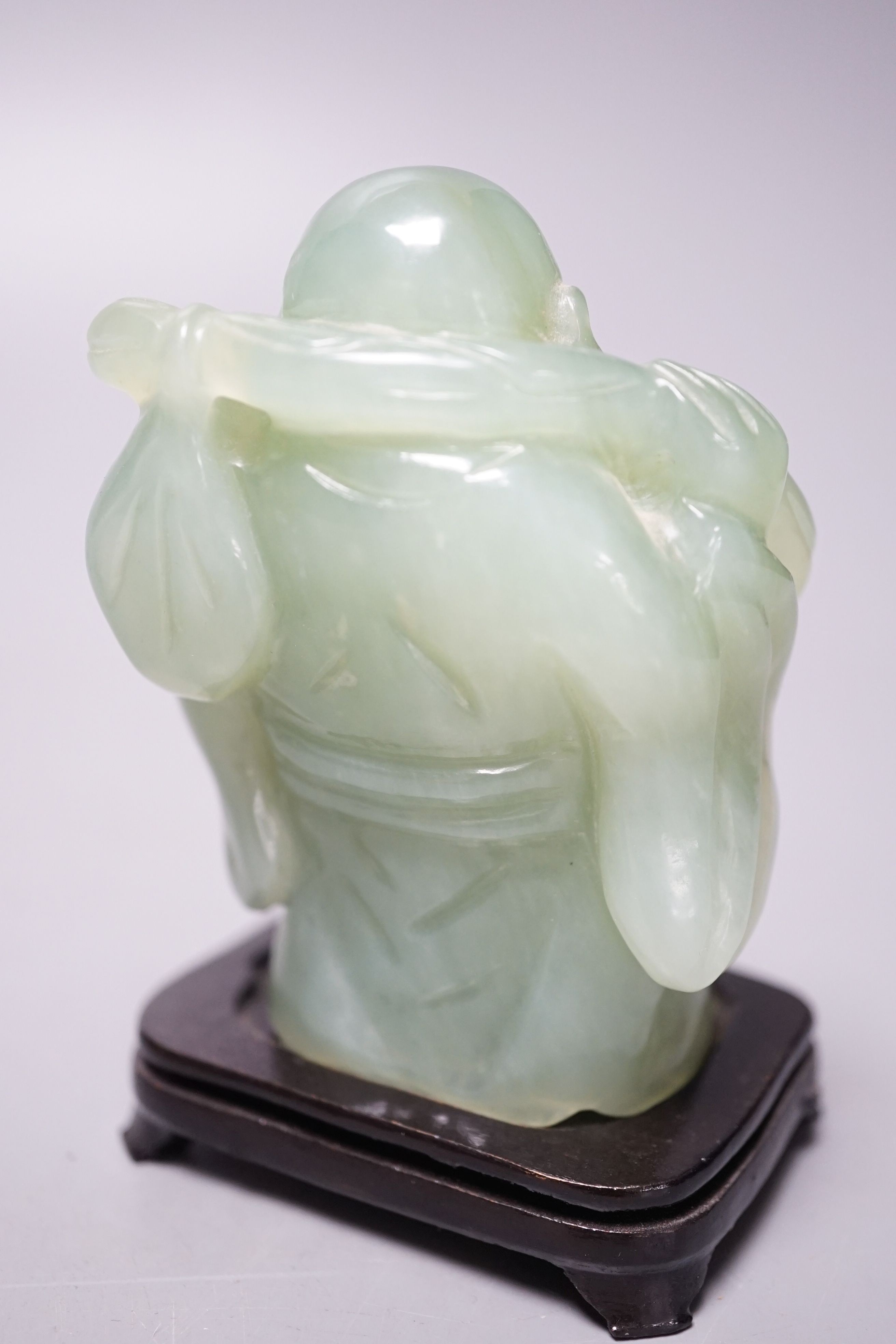 Two bowenite carvings of an elephant and Budai, wood stands, tallest, 9.5cm